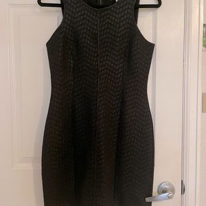 Black Monteau dress. Gives hourglass figure. very nice.